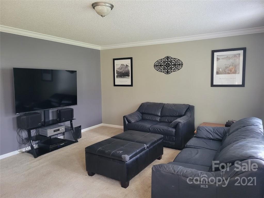 212 Hatchway Road, Unit A & B Indian Land, SC 29707 - Photo 4 of 27 a living room with couches and a flat screen tv
