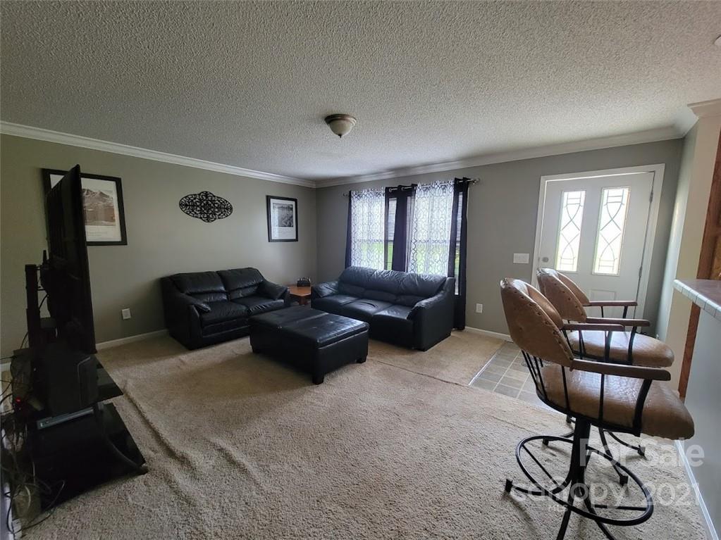 212 Hatchway Road, Unit A & B Indian Land, SC 29707 - Photo 5 of 27 a living room with furniture ceiling fan and a window