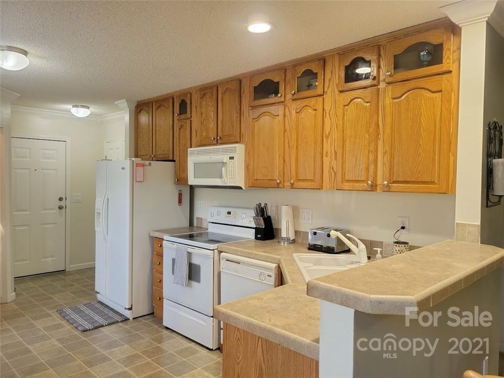 212 Hatchway Road, Unit A & B Indian Land, SC 29707 - Photo 7 of 27 a kitchen with stainless steel appliances granite countertop a sink a stove and a refrigerator