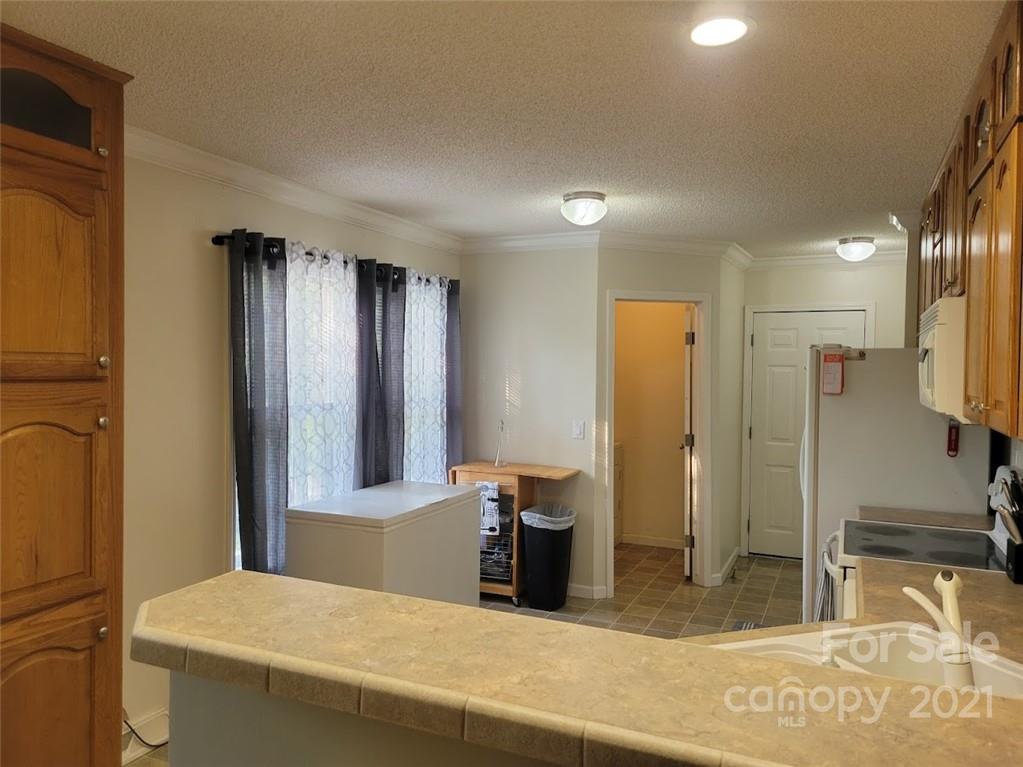 212 Hatchway Road, Unit A & B Indian Land, SC 29707 - Photo 8 of 27 a bathroom with a granite countertop sink and a mirror