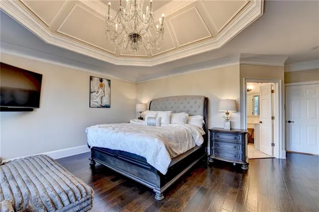 a kitchen with granite countertop white cabinets and white stainless steel appliances