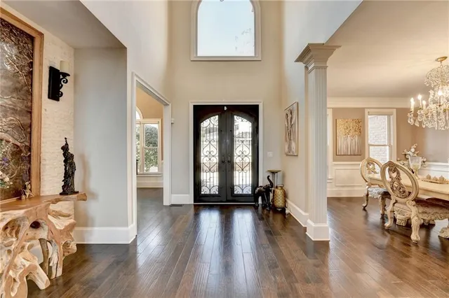 a living room with furniture fireplace and a large window