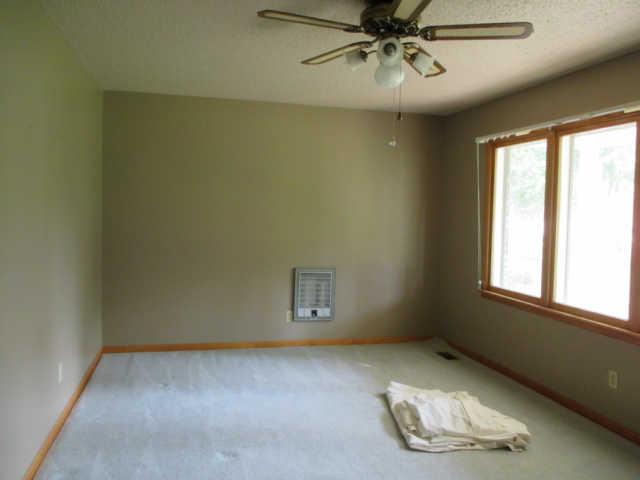 144 Choates Creek Road Lawrenceburg, TN 38464 - Photo 7 of 20 Large Living Room has Lots of Windows for Natural Sun Light and Also has Original Oak Hardwood Flooring under the Carpet