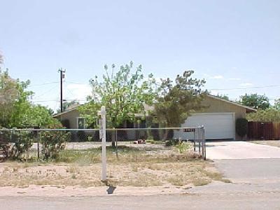 13076 Pawnee Road Apple Valley, CA 92308 - Photo 1 of 1 a backyard of a house