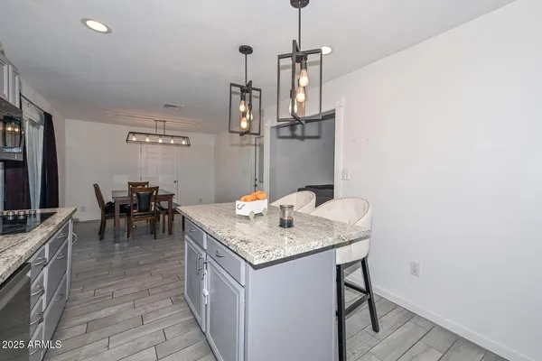 a view of a kitchen area with furniture and chandelier