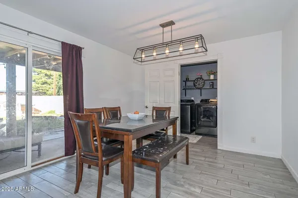 a view of a dining room with furniture window and wooden floor