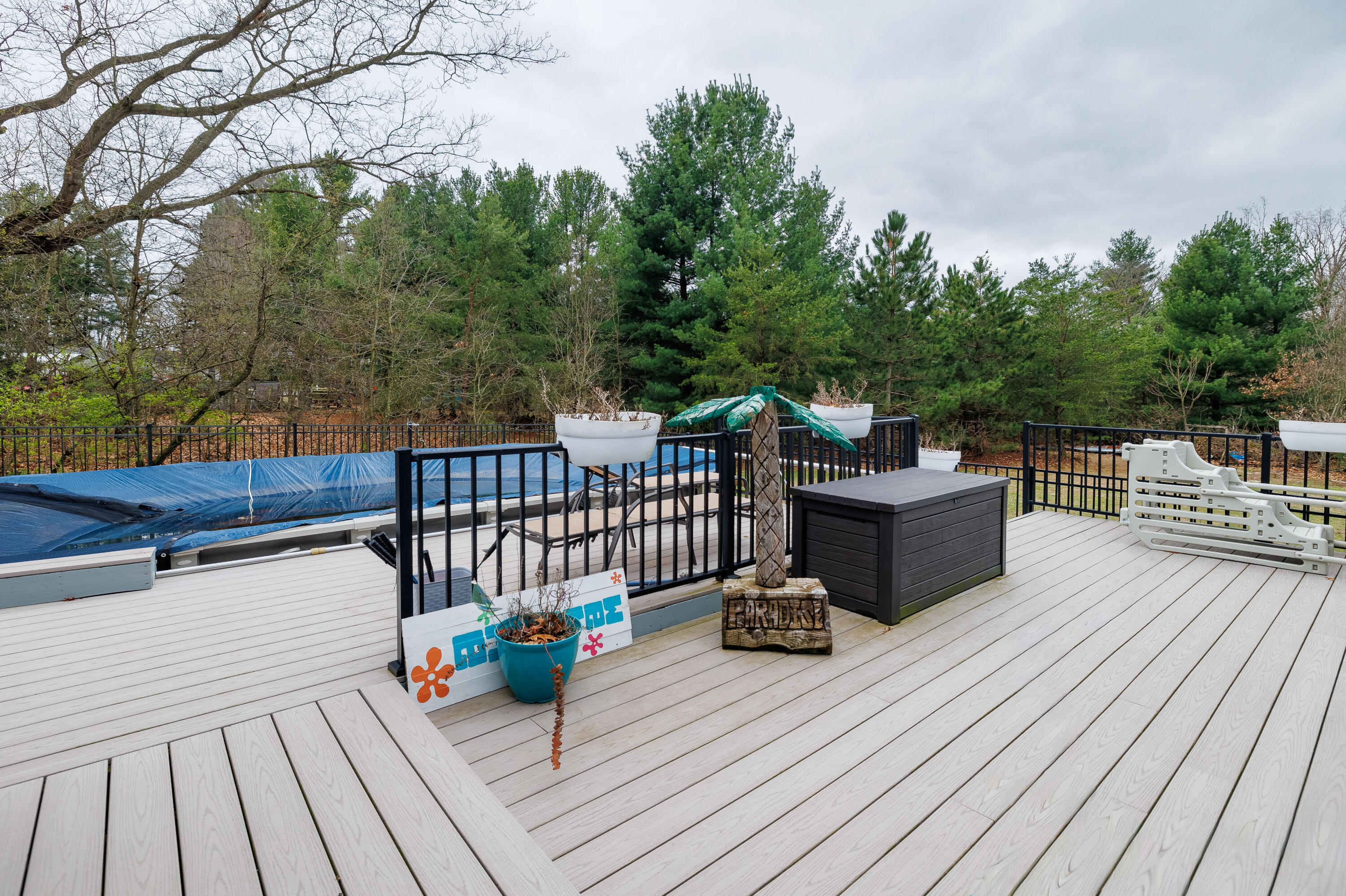 6795 Whispering Woods Drive Demotte, IN 46310 - Photo 12 of 64 a view of a roof deck with wooden floor and fence