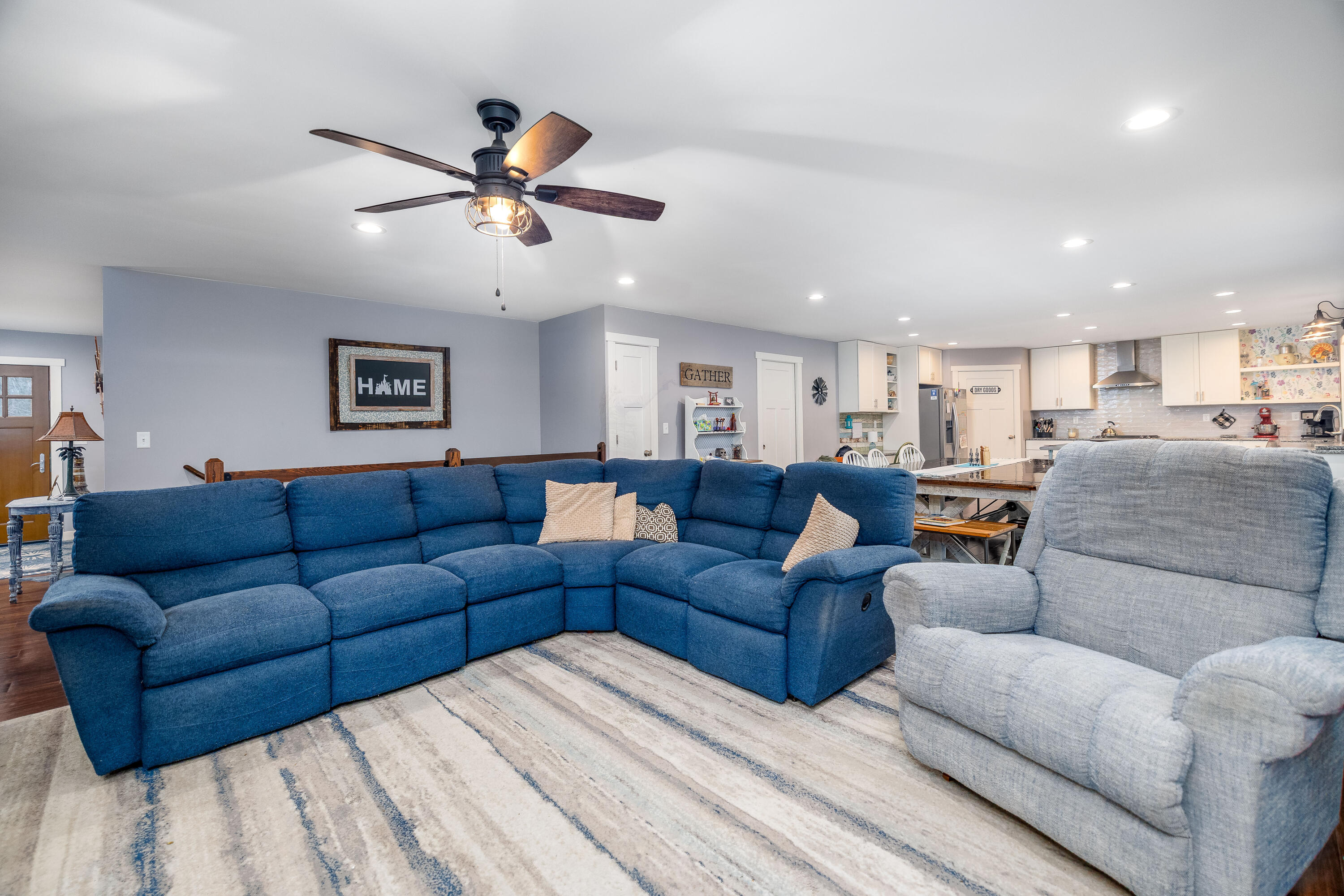 6795 Whispering Woods Drive Demotte, IN 46310 - Photo 30 of 64 a living room with furniture and a ceiling fan