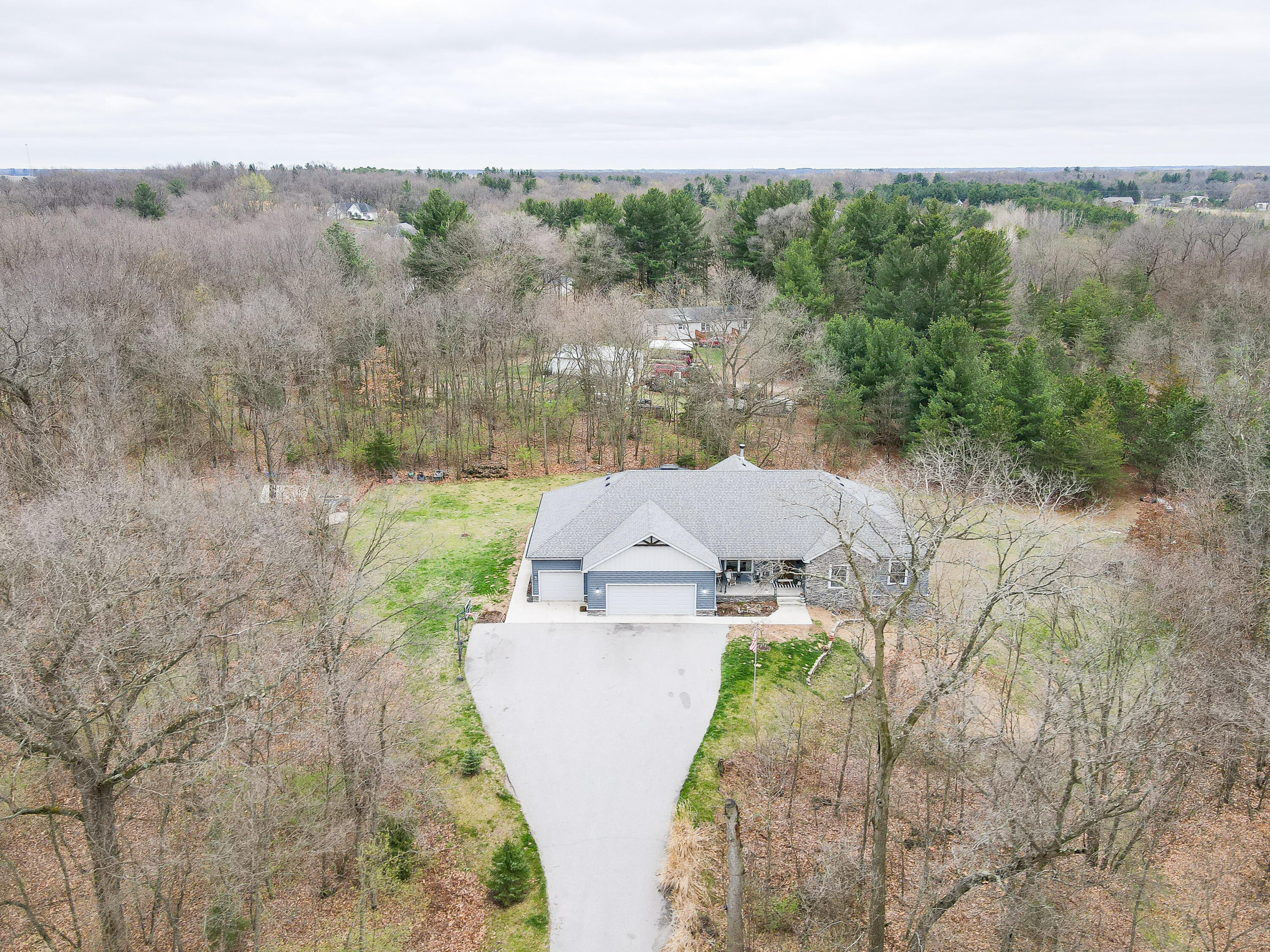 6795 Whispering Woods Drive Demotte, IN 46310 - Photo 3 of 64 an aerial view of a house with a yard