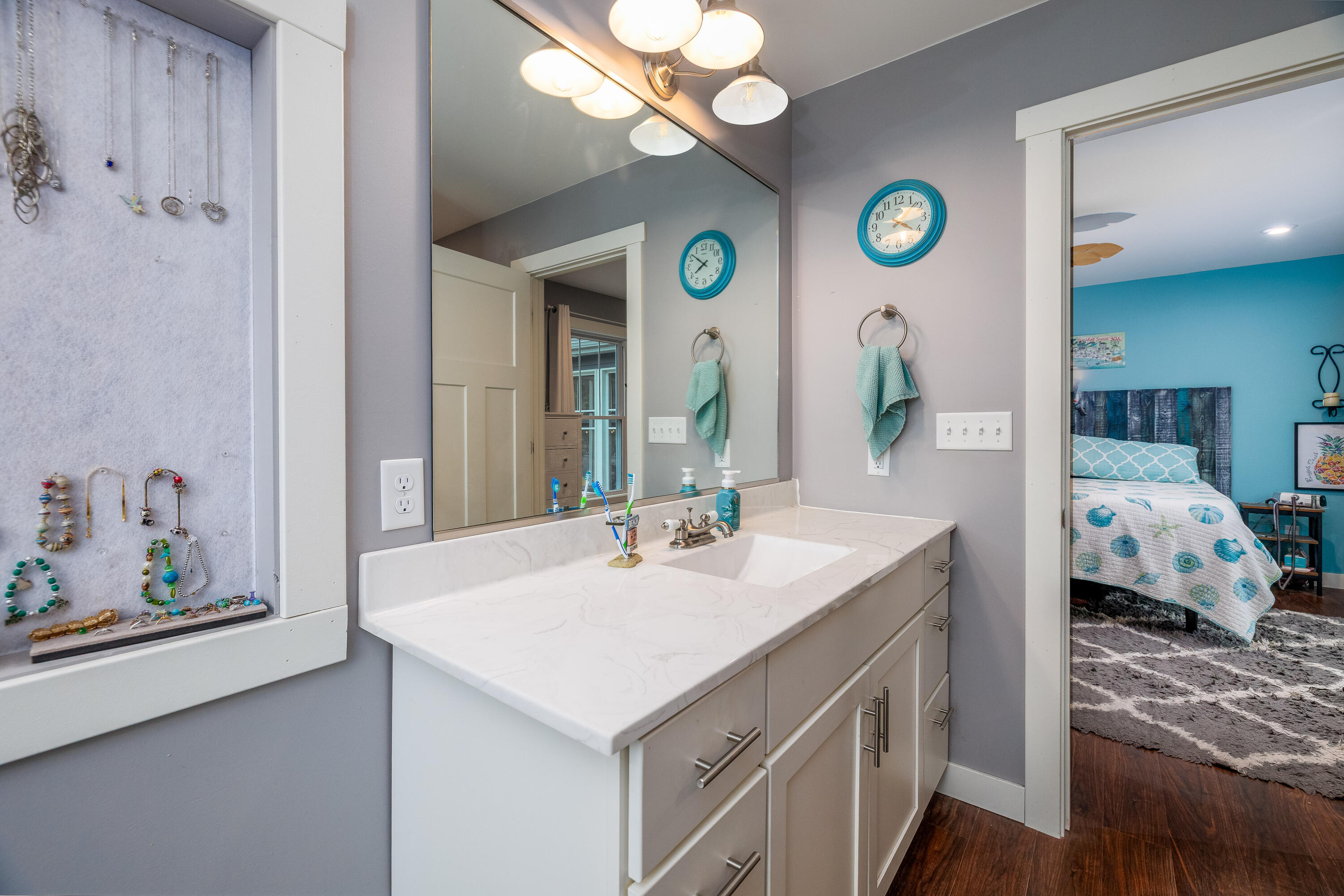 6795 Whispering Woods Drive Demotte, IN 46310 - Photo 38 of 64 a en suite bathroom with a sink and a mirror