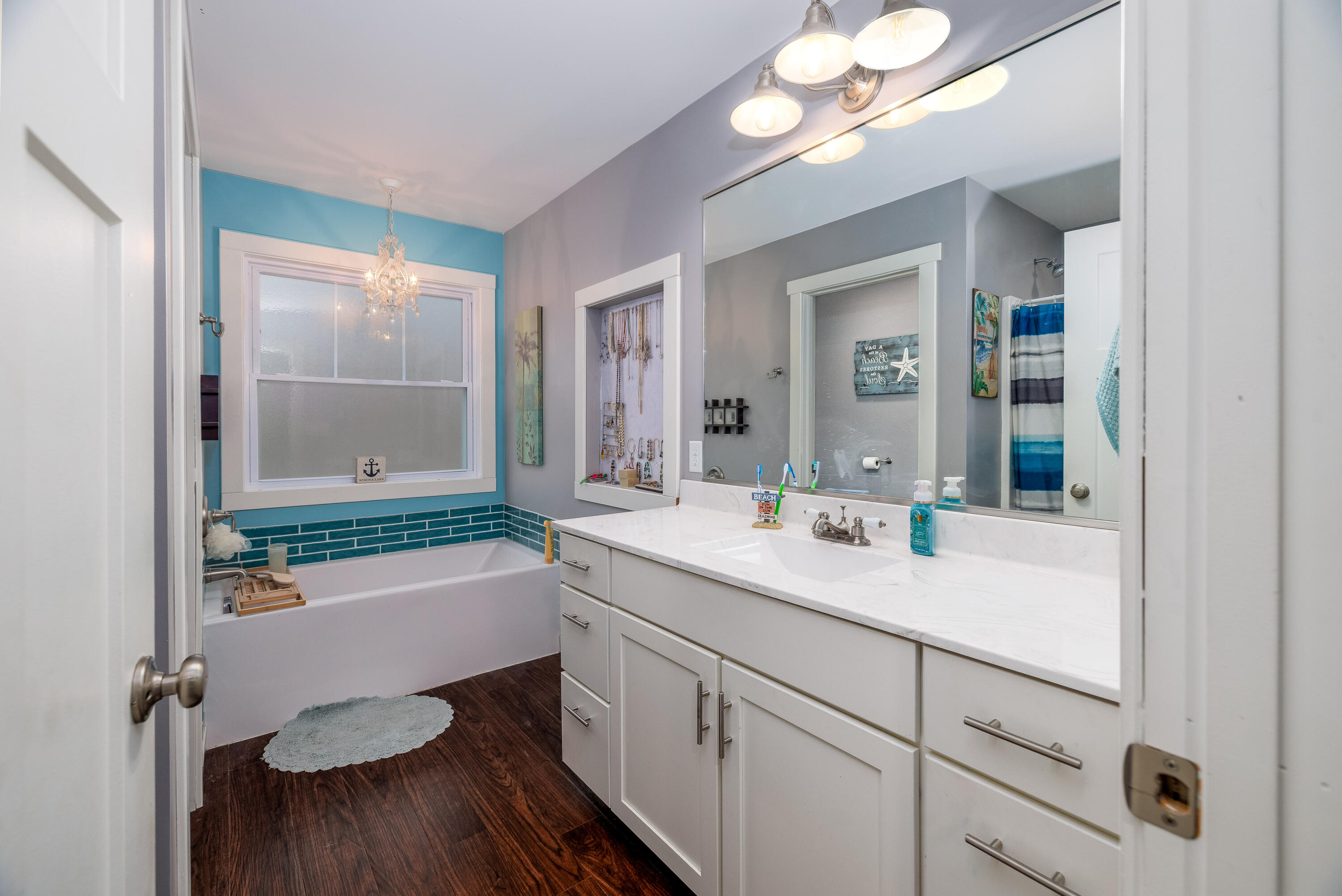 6795 Whispering Woods Drive Demotte, IN 46310 - Photo 39 of 64 a bathroom with a sink a toilet a mirror and shower