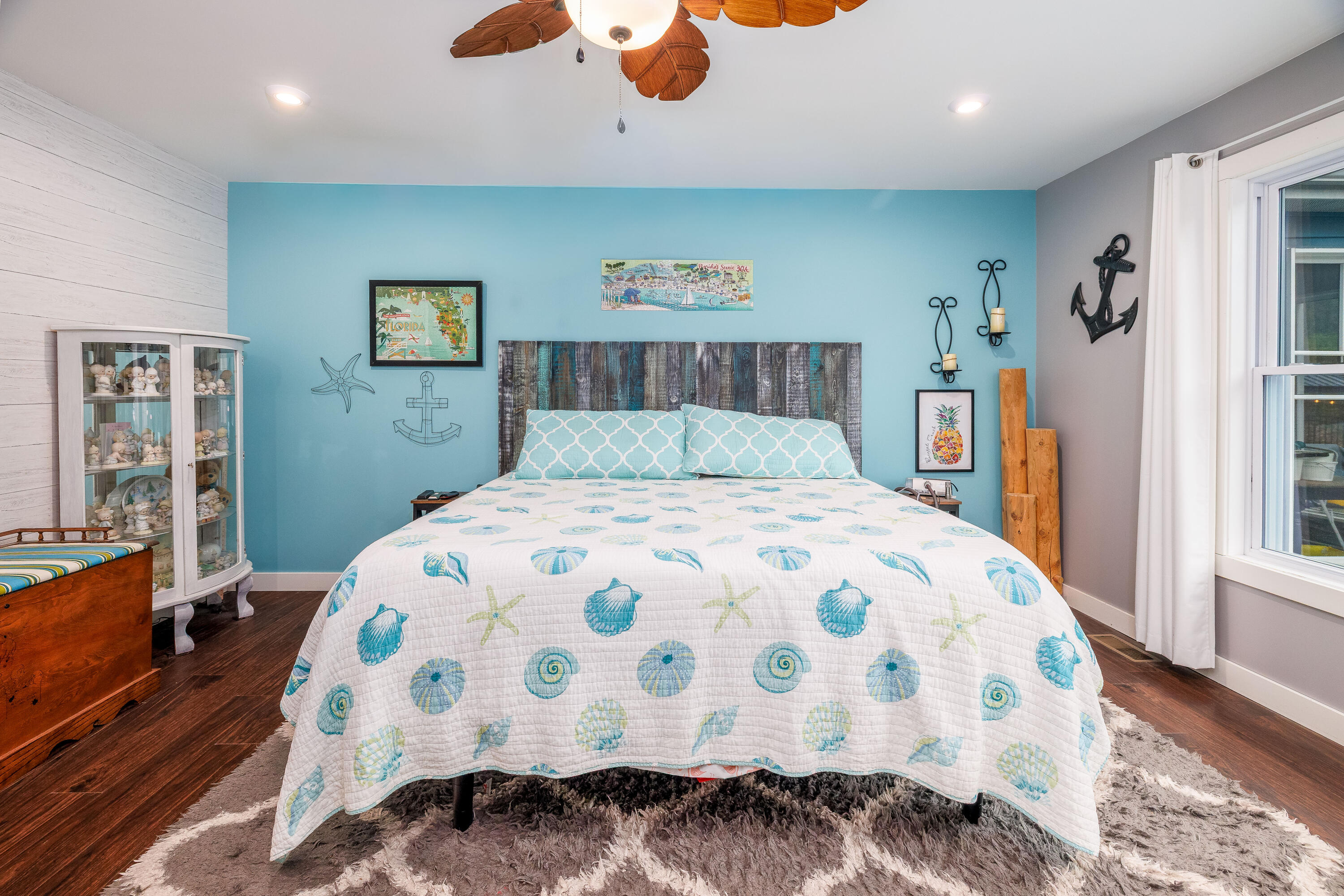 6795 Whispering Woods Drive Demotte, IN 46310 - Photo 41 of 64 a bedroom with a large bed and a wooden floor
