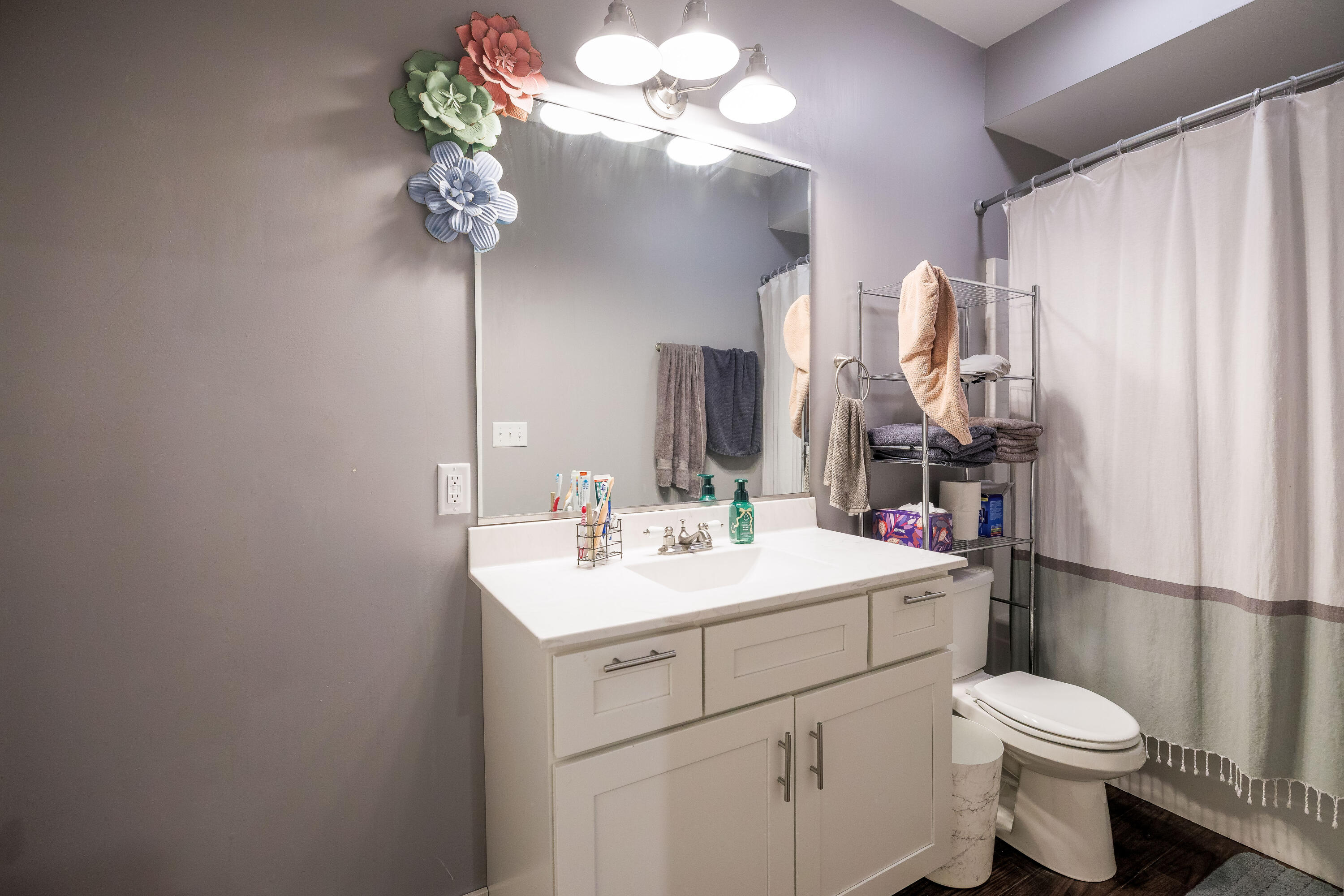 6795 Whispering Woods Drive Demotte, IN 46310 - Photo 54 of 64 a bathroom with a toilet sink and mirror
