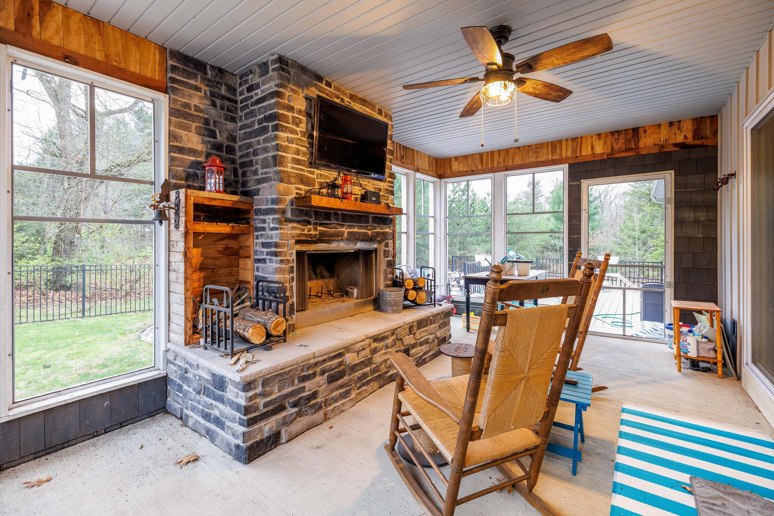 6795 Whispering Woods Drive Demotte, IN 46310 - Photo 62 of 64 a living room with fireplace furniture and a large window