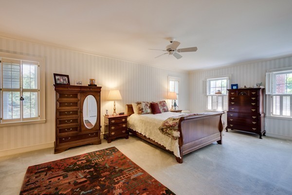 4 Bruce Road Winchester, MA 01890 - Photo 15 of 26 a spacious bedroom with a bed dresser and a window