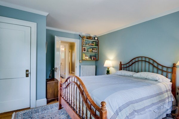 4 Bruce Road Winchester, MA 01890 - Photo 18 of 26 a bedroom with a bed and a night stand