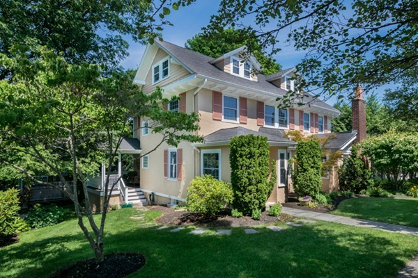 4 Bruce Road Winchester, MA 01890 - Photo 2 of 26 a front view of a house with a garden and plants