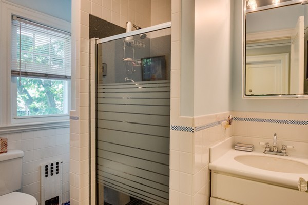 4 Bruce Road Winchester, MA 01890 - Photo 21 of 26 a bathroom with a sink and a mirror