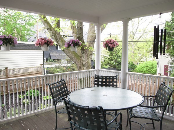 4 Bruce Road Winchester, MA 01890 - Photo 24 of 26 a view of a dining table and chairs in the roof deck