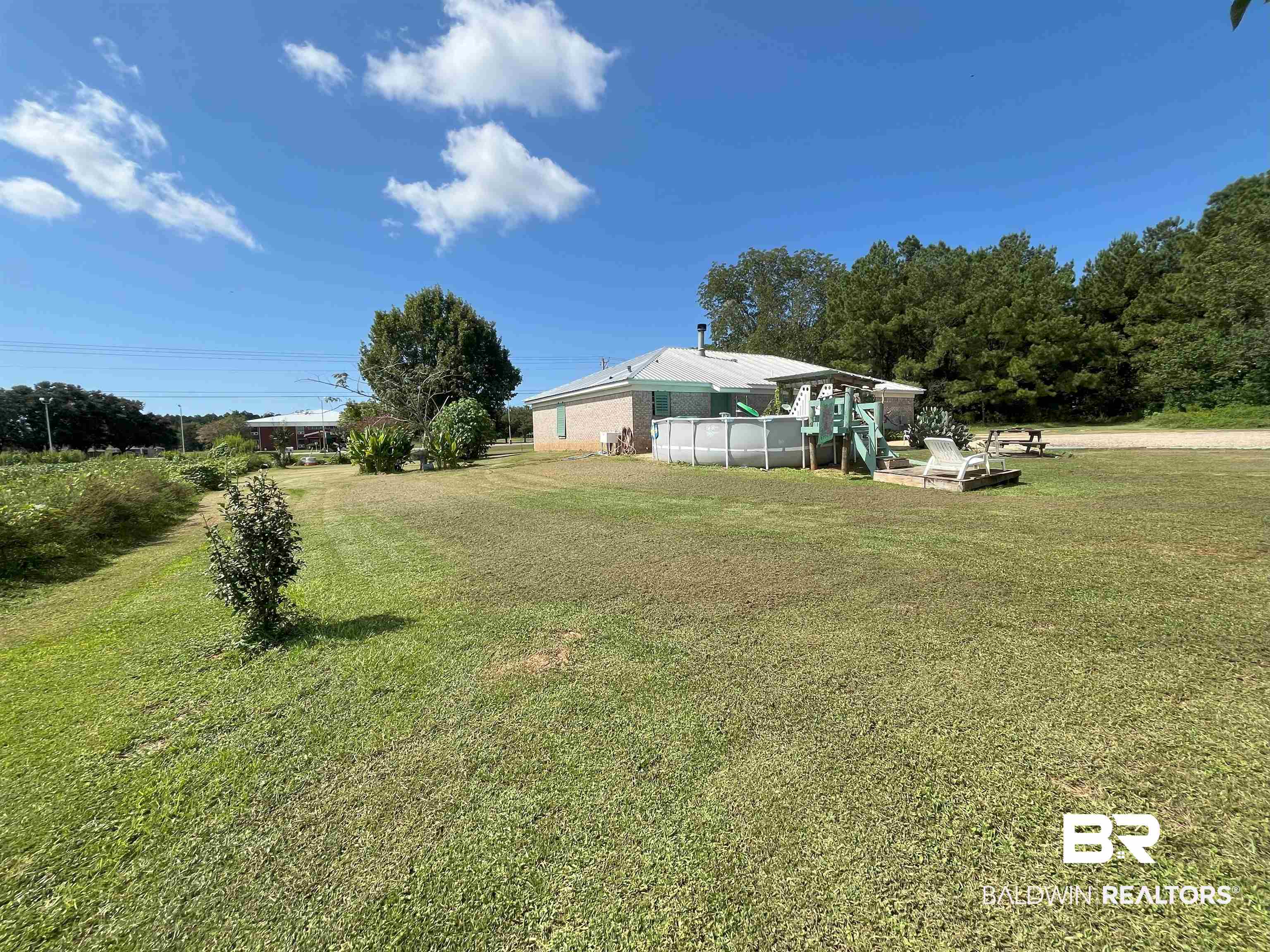 7851 Highway 98 Fairhope, AL 36532 - Photo 32 of 40 View of grassy yard featuring an outdoor pool