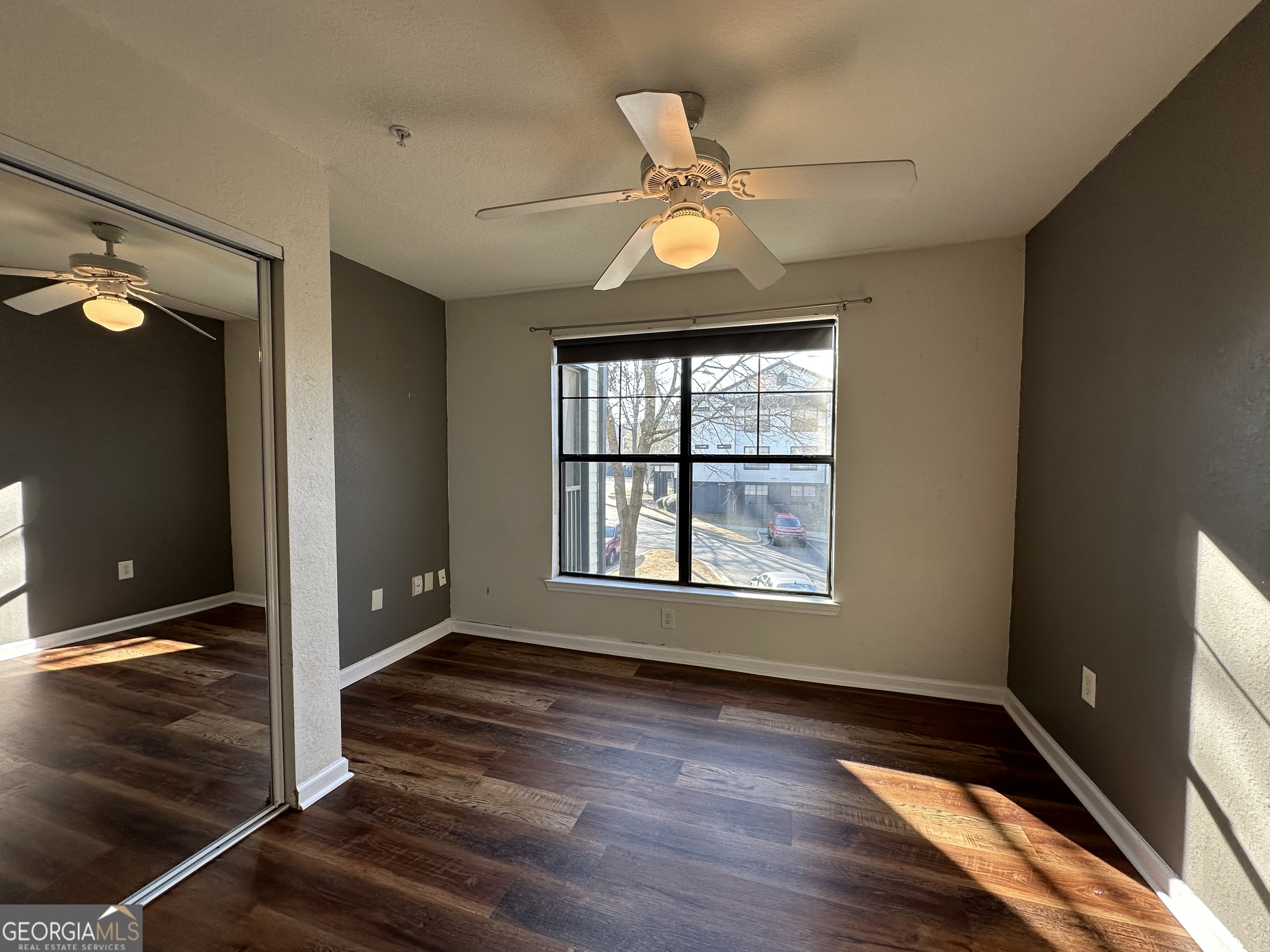 211 North Avenue Athens, GA 30601 - Photo 11 of 18 an empty room with wooden floor fan and windows