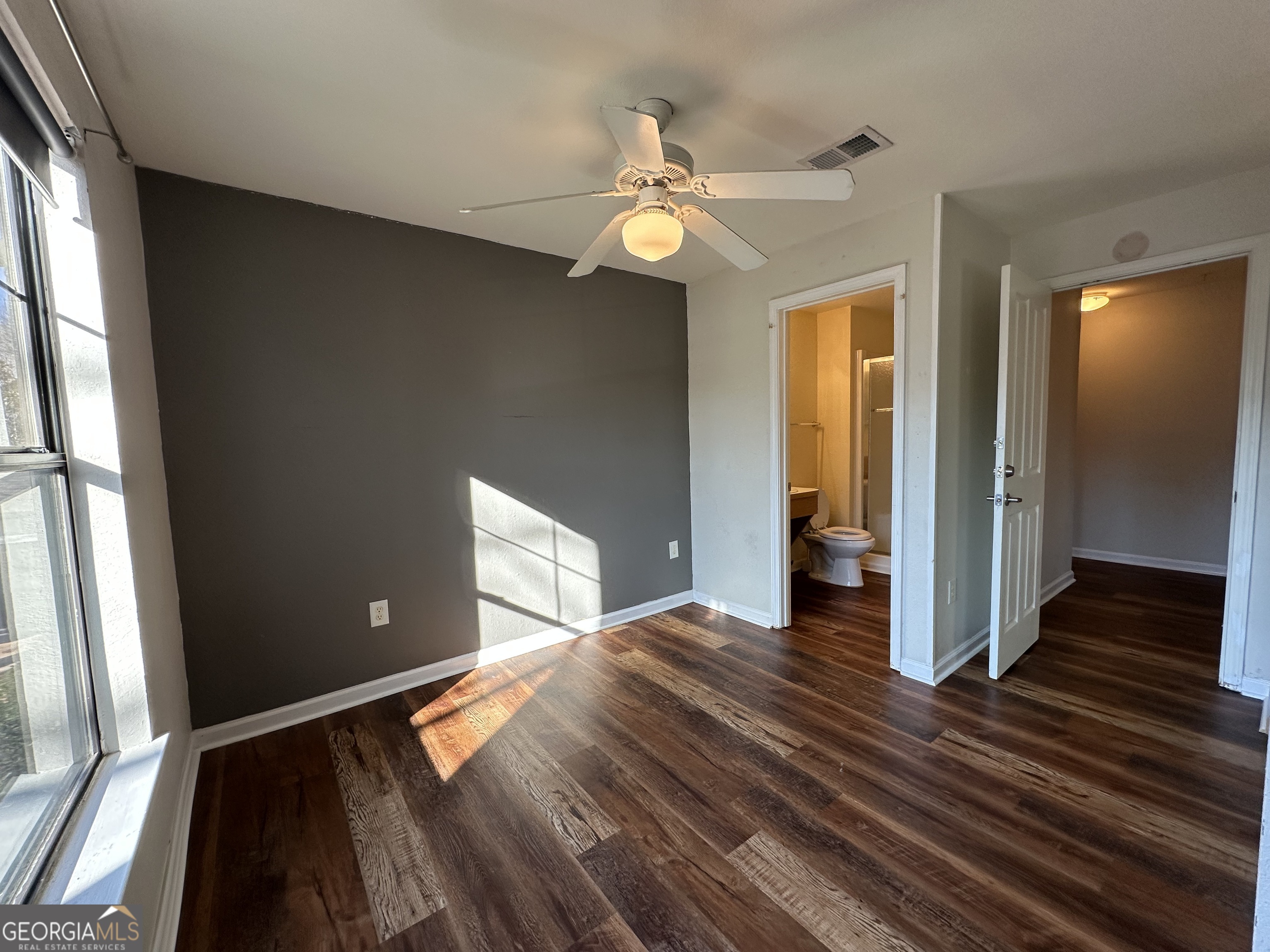 211 North Avenue Athens, GA 30601 - Photo 13 of 18 a view of an empty room with wooden floor and a window
