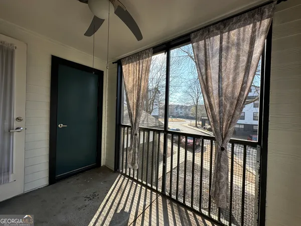a view of a porch with wooden floor and outdoor space