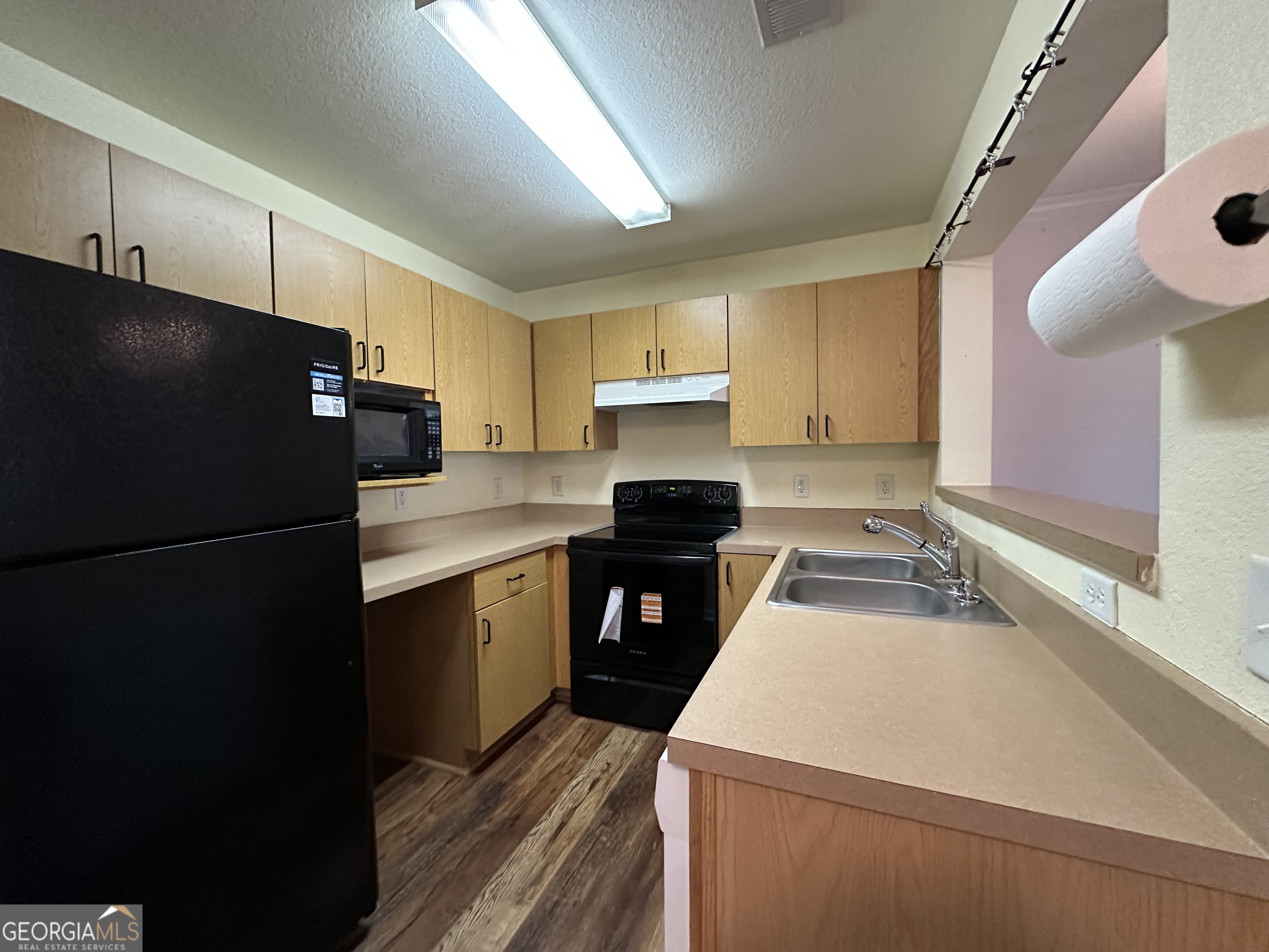 211 North Avenue Athens, GA 30601 - Photo 7 of 18 a kitchen with a refrigerator and a sink