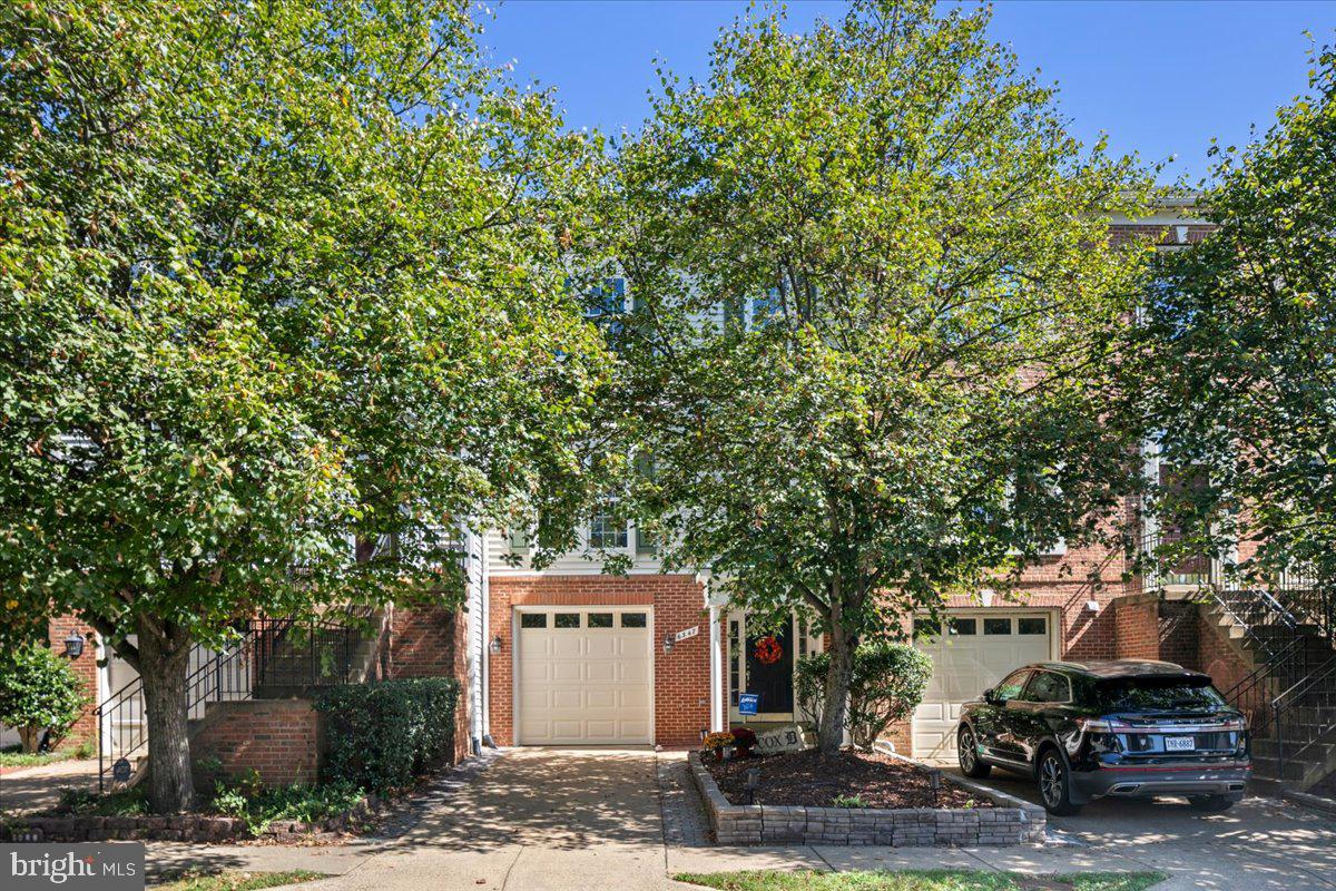 a sign that is sitting in front of a house