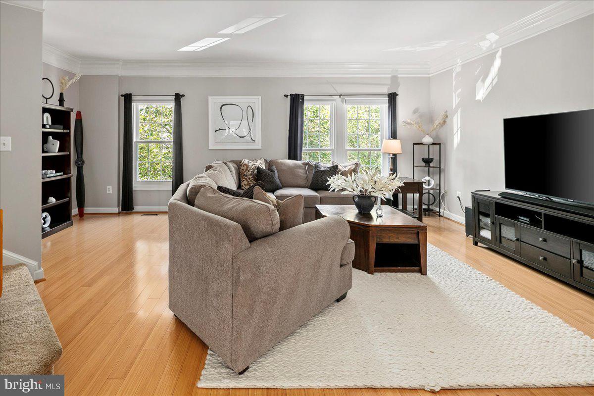 6347 Simmer Circle Springfield, VA 22150 - Photo 12 of 47 a living room with furniture and a flat screen tv