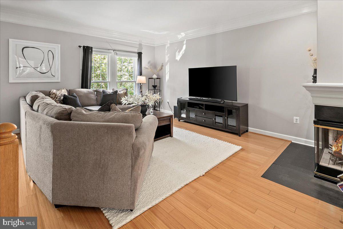 6347 Simmer Circle Springfield, VA 22150 - Photo 13 of 47 a living room with furniture and a flat screen tv