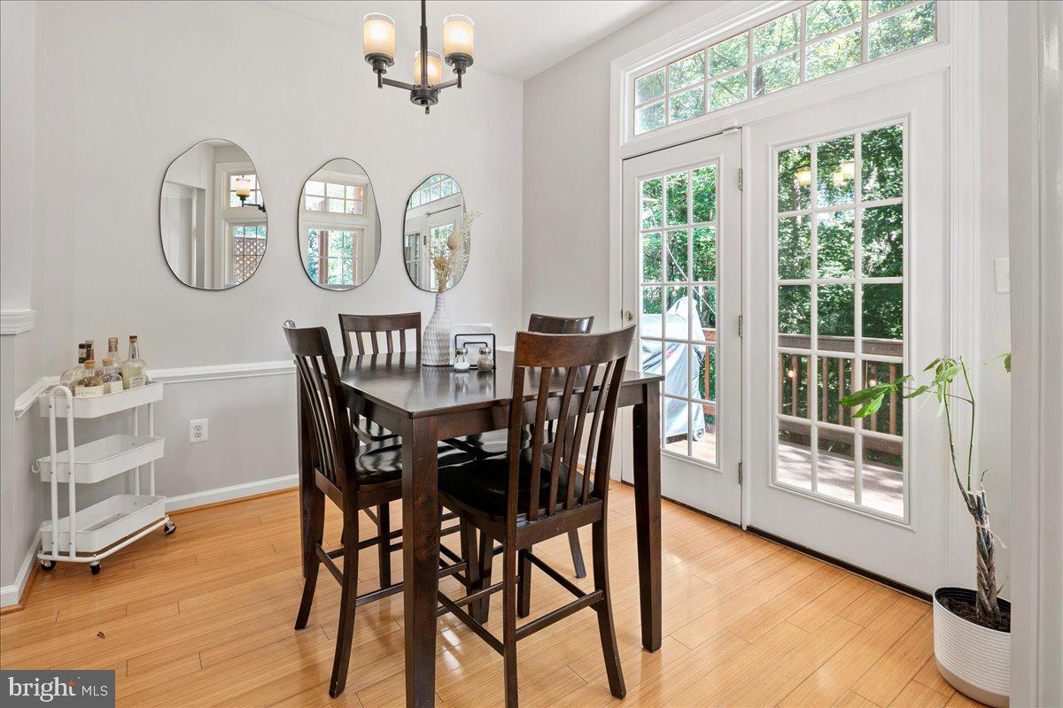 6347 Simmer Circle Springfield, VA 22150 - Photo 23 of 47 a view of a dining room with furniture window and wooden floor