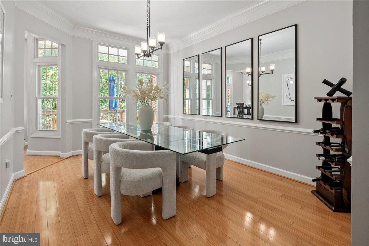 6347 Simmer Circle Springfield, VA 22150 - Photo 26 of 47 a view of a dining room with furniture wooden floor and chandelier