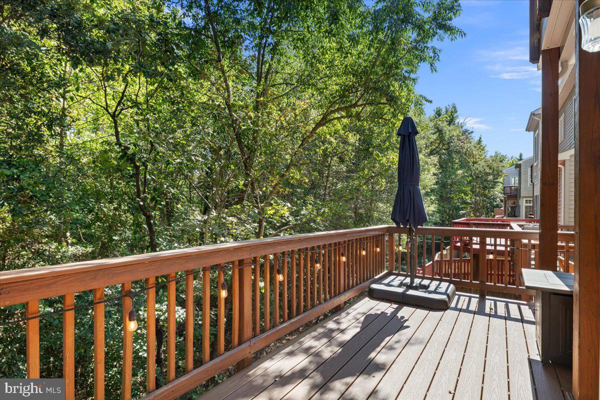6347 Simmer Circle Springfield, VA 22150 - Photo 30 of 47 a view of a wooden deck with a trees