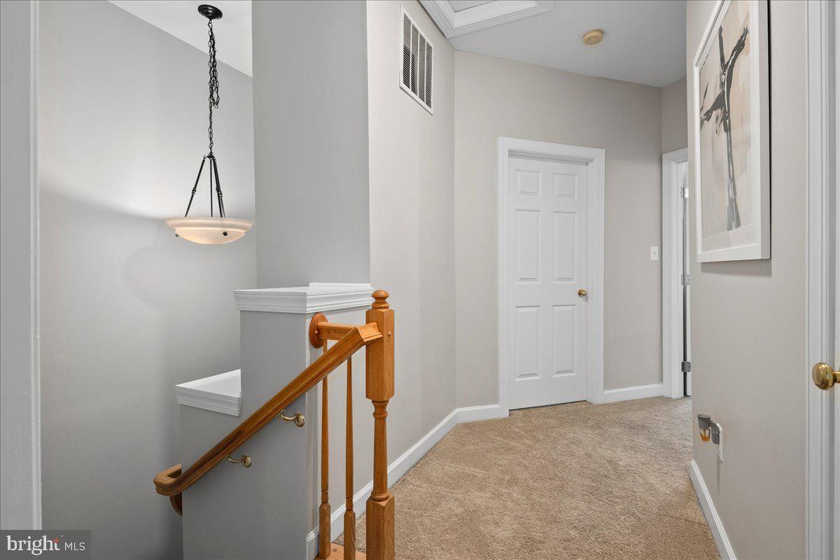 6347 Simmer Circle Springfield, VA 22150 - Photo 33 of 47 a view of a hallway with staircase