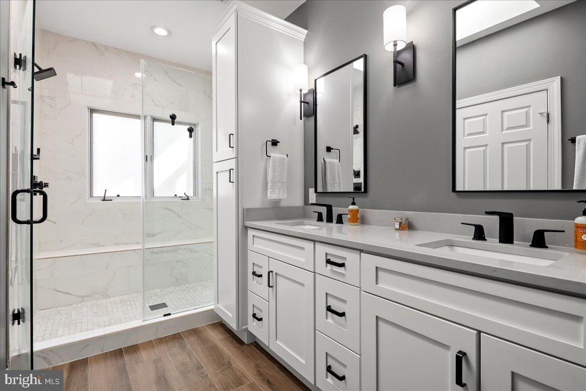 6347 Simmer Circle Springfield, VA 22150 - Photo 37 of 47 a bathroom with a double vanity sink mirror and double