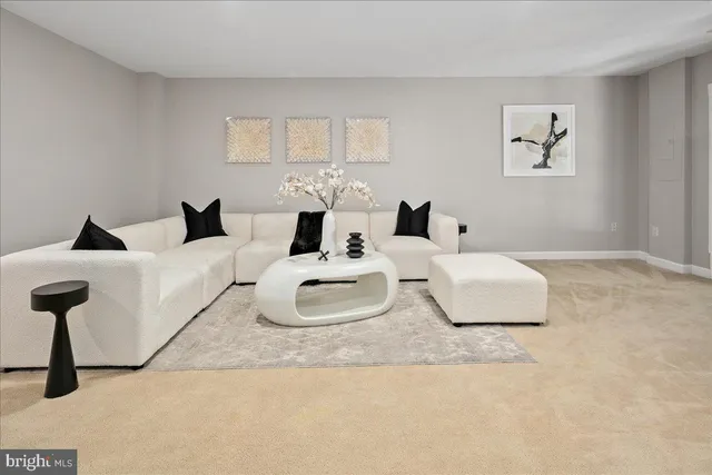 a living room with furniture and a lamp