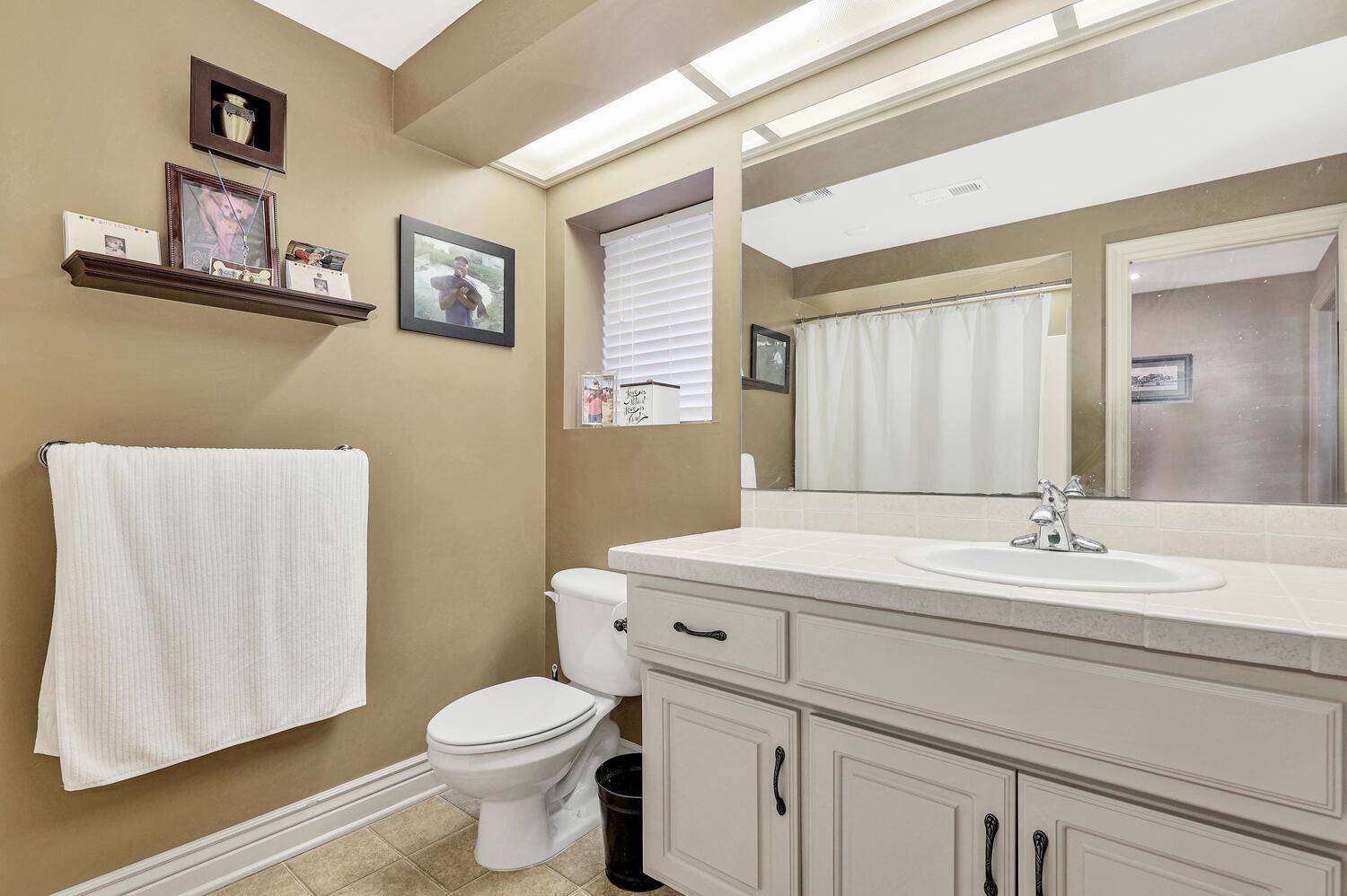13204 East Stampede Street Wichita, KS 67230 - Photo 29 of 35 Basement bathroom has tub/shower combo and a lot of floor space.