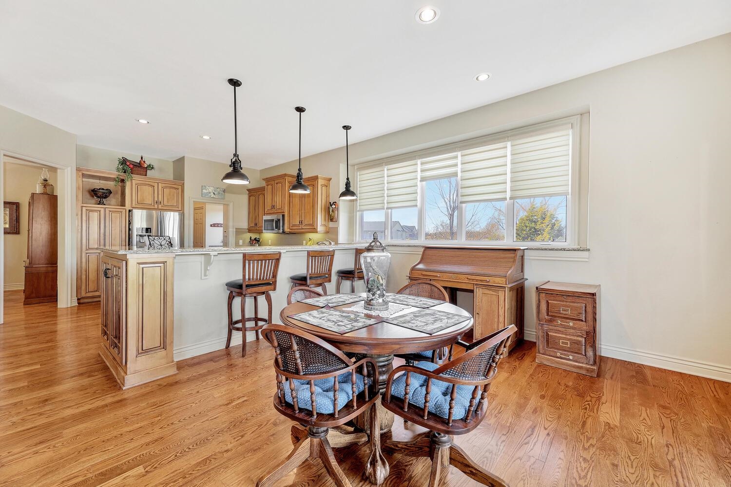 13204 East Stampede Street Wichita, KS 67230 - Photo 9 of 35 Kitchen has an eating space and eating bar and wet bar and island and pantry in the laundry room.