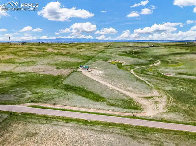 a view of a golf course with a ocean