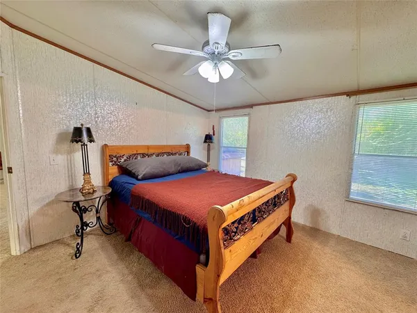 a view of a living room and kitchen