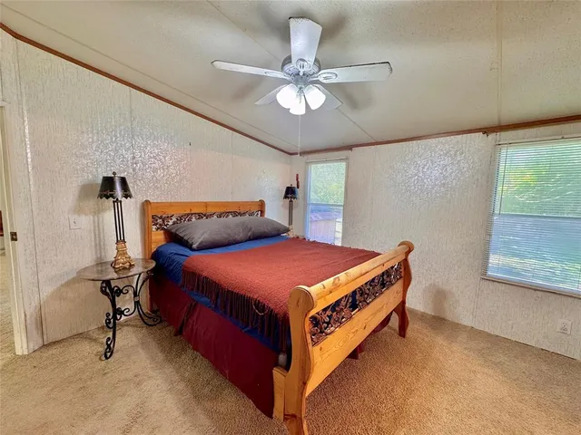 a view of a living room and kitchen
