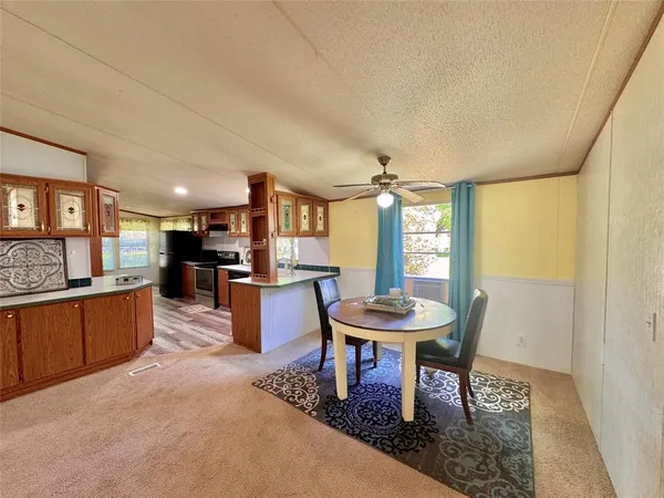 a kitchen with a sink stove and refrigerator