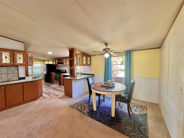a kitchen with a sink stove and refrigerator
