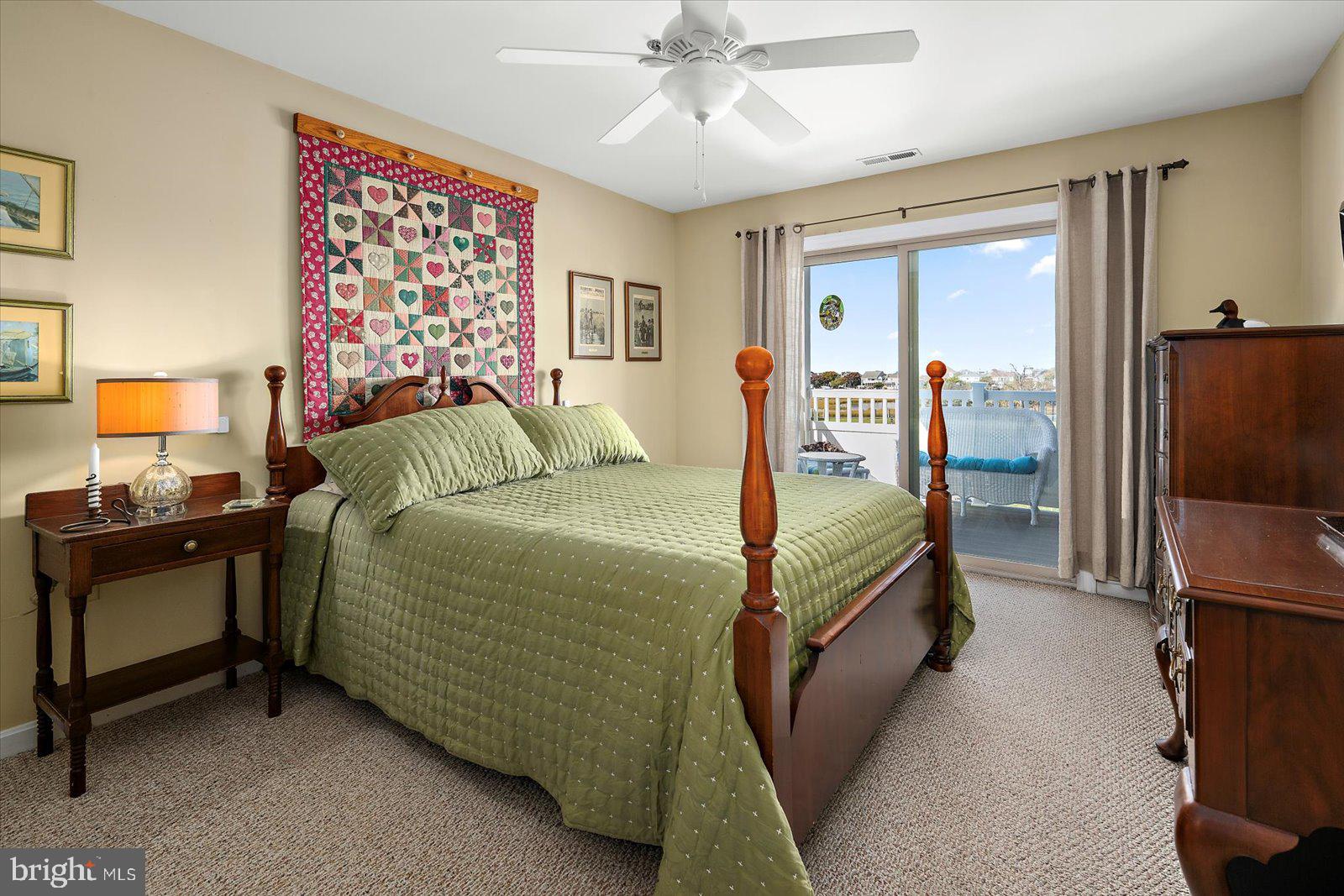 201 South Heron Drive, Unit 2D Ocean City, MD 21842 - Photo 14 of 61 a bedroom with a bed and a chandelier