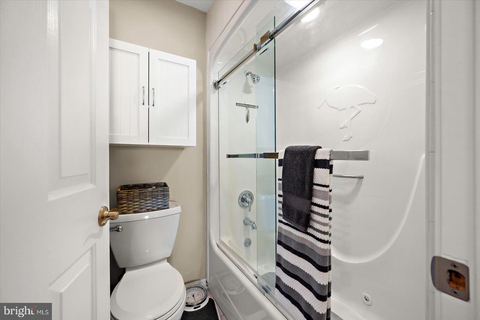 201 South Heron Drive, Unit 2D Ocean City, MD 21842 - Photo 18 of 61 a white toilet sitting next to a bathroom sink