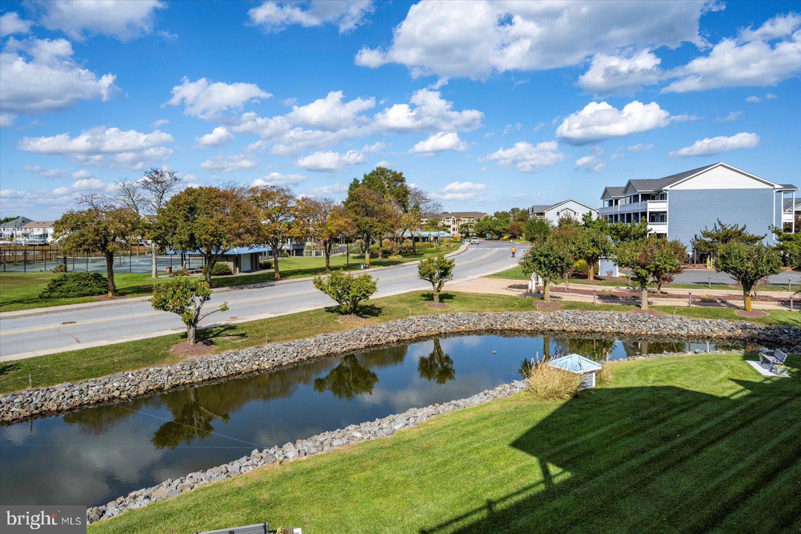 201 South Heron Drive, Unit 2D Ocean City, MD 21842 - Photo 2 of 61 a view of a lake with a big yard