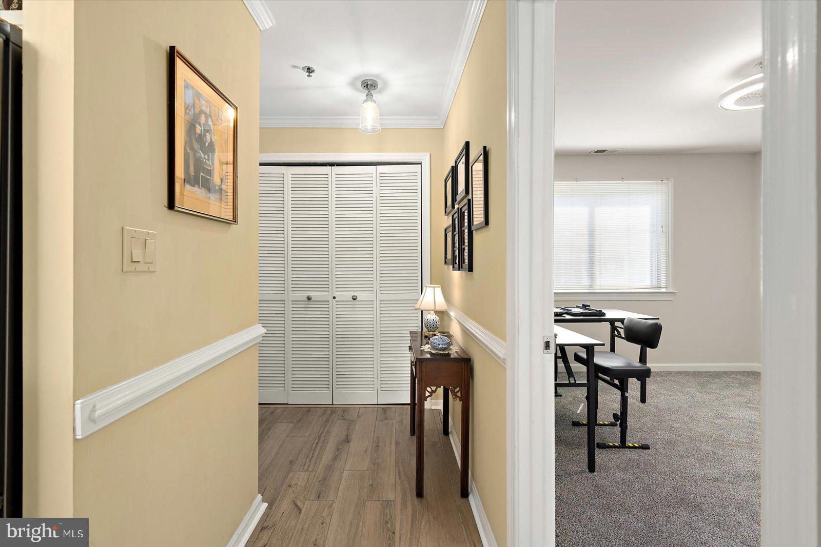 201 South Heron Drive, Unit 2D Ocean City, MD 21842 - Photo 19 of 61 a view of hallway with furniture and wooden floor