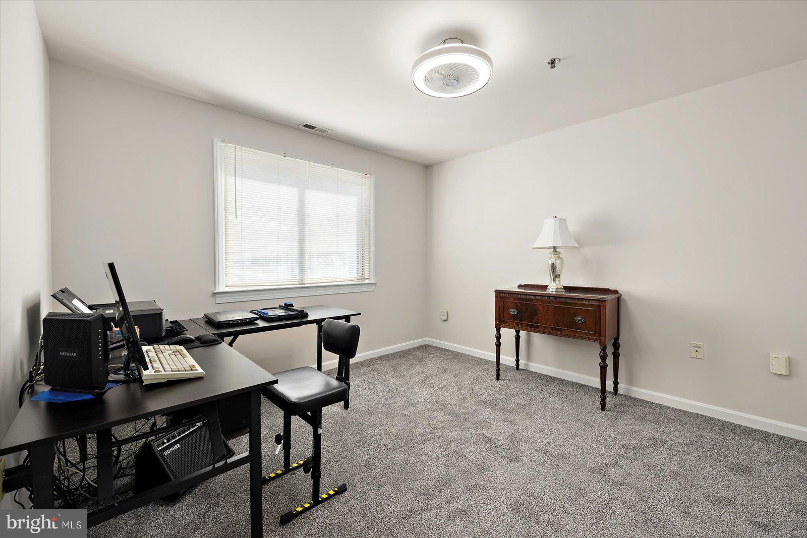 201 South Heron Drive, Unit 2D Ocean City, MD 21842 - Photo 20 of 61 a living room with furniture and a window