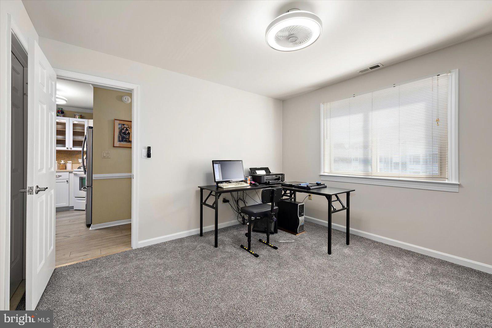 201 South Heron Drive, Unit 2D Ocean City, MD 21842 - Photo 21 of 61 a view of a workspace with furniture and a window